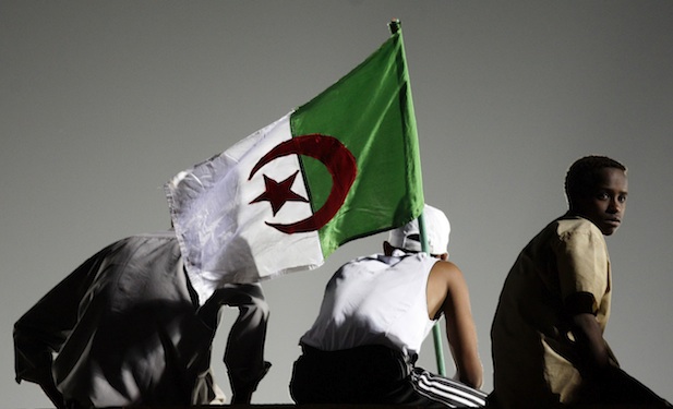 Algerian soccer fans wave Algerian flag