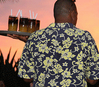 Waiter carrying tray of Mai Tais