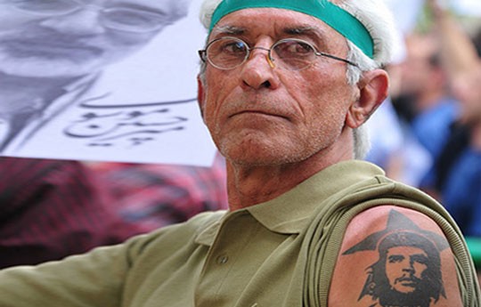 A Mousavi supporter sports a Che Guevara tattoo at a rally in Tehran.